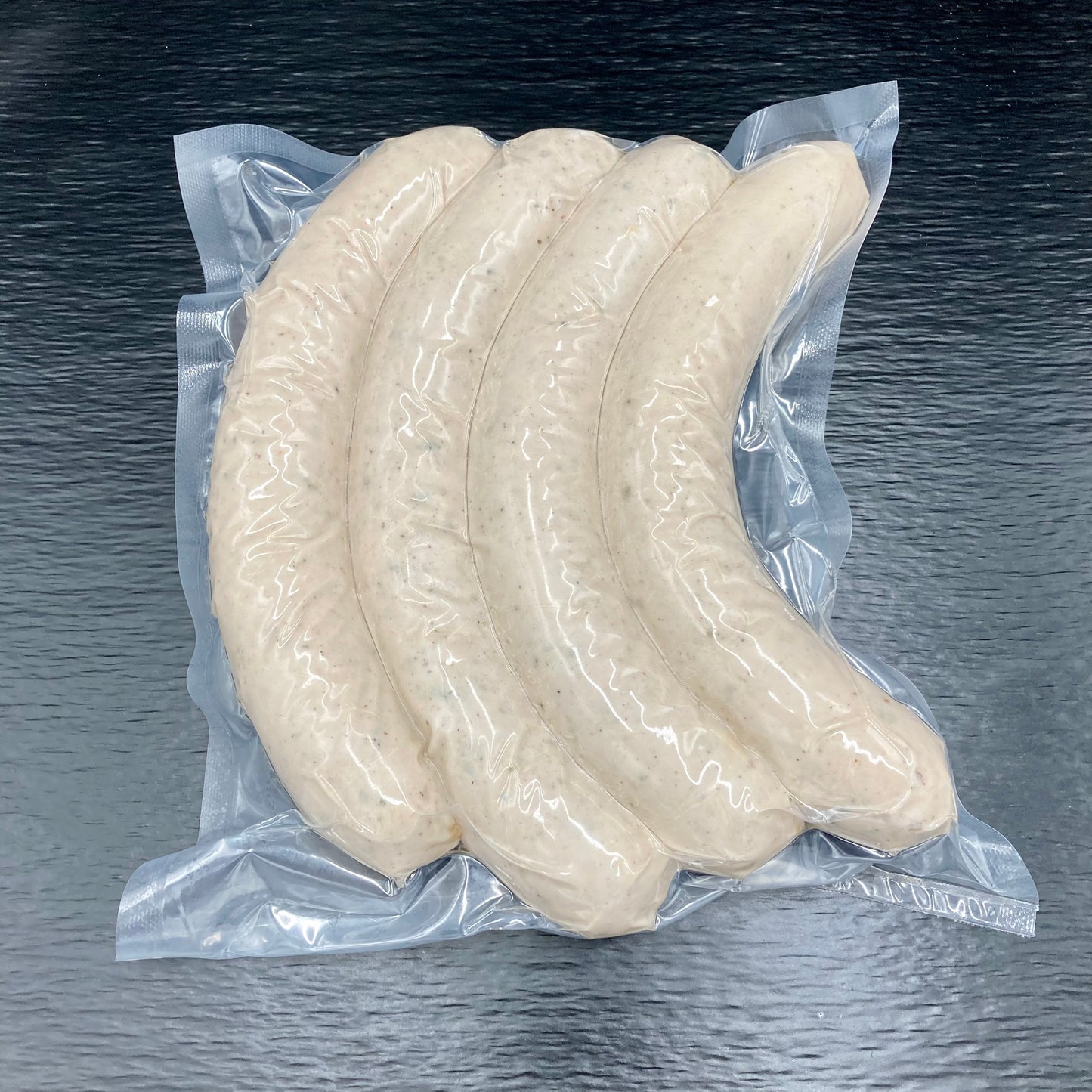 Vier Hauseigene Bratwürste vakuumiert verpackt